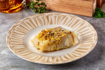 Steamed cod fish fillet with spices