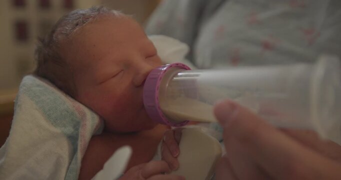 Preemie Baby Drinking a Bottle in the NICU Close Up