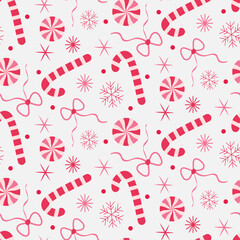 Cute Christmas candy canes and sticks with bows and snow in red and pink seamless pattern on white background. For Fabric, textile and Christmas decoration