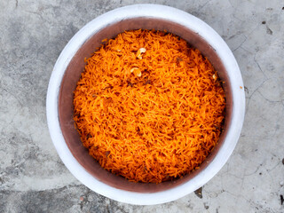 orange sweet rice in big pot. Jarda is sweet rice recipe, Muslims traditional food. Zarda Sweet rice Bangladeshi Recipes, Famous Bangladeshi, Pakistani and Indian Sweet Rice