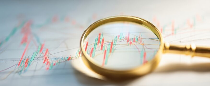 The magnifying glass revealing financial trends on a detailed chart