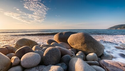 close up shot of a cluster of rocks on a serene beach capturing the raw beauty of coastal formations