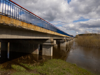 bridge, river, water, architecture, sky, transportation, travel, road, city, structure, construction, building, landscape, railway, landmark, reflection, transport, clouds, sea, coast, train, concrete
