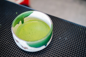 Green tea cup traditional ceramic bowl with frothy matcha powder in japanese style culture for tea ceremony