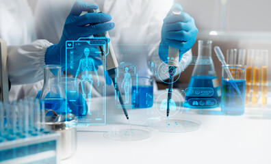 Medical or research scientist or doctor using looking at a test tube of clear solution in a lab or laboratory.