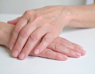 Fototapeta premium Close-up of Woman's Hands Showing Signs of Aging and Time