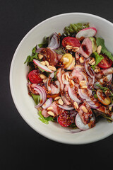Salad with sauce in a large serving