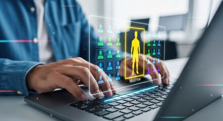Person using laptop with holographic human anatomy overlay