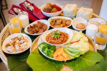 Traditional Japanese style cuisine with variety of dishes and fresh vegetables served on woven tray reflecting culture and authentic flavors in warm inviting setting