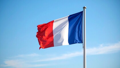 "French flag with vertical blue, white, and red stripes waving against clear blue sky."