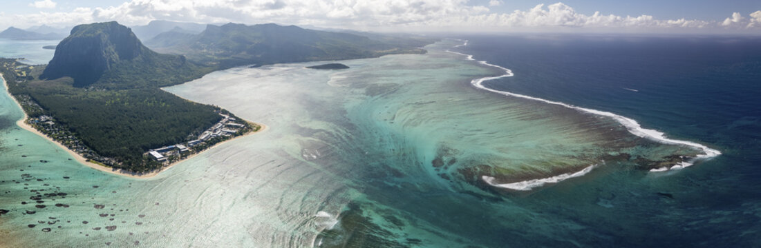 Aerial view of beautiful tropical coastline with blue ocean and reef, Distrito de Black River, Mauritius.