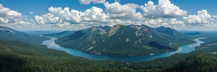Obraz premium Panoramic view of a winding river and surrounding mountains.