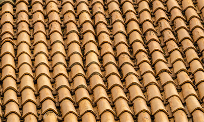 orange and brown old tile roof texture background. Old vintage roof tiles backdrop for concept and design.