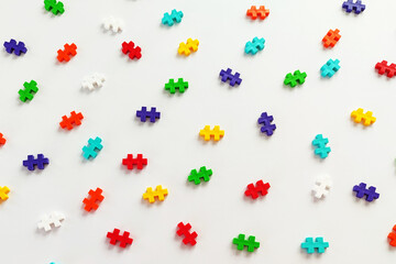 Colorful jigsaw puzzle pieces on white background