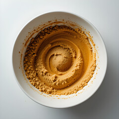 Top View of Whipped Coffee Foam in White Bowl on Light Background