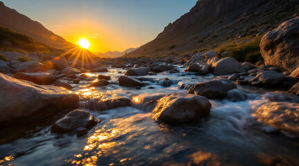 Serene mountain stream at sunrise with golden light and rocky landscape