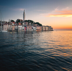 Fototapeta premium Rovinj Old Town at Sunset with Sailboats on the Adriatic Coast