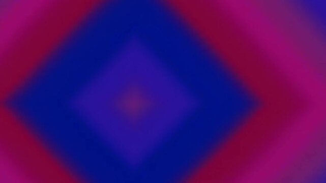 A blurred, diamond-shaped gradient transitions from blue and purple in the center to red and orange at the edges.
