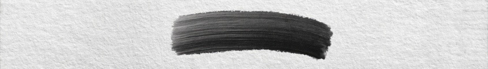 Dark gray paint stroke on a light gray background