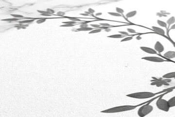 Gray floral wreath design on a white textured surface