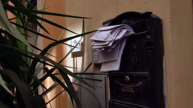 Old Mailbox Overflowing with Letters in Historic Center of Palermo, Italy