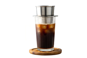 Iced vietnamese coffee being brewed with phin filter on a wooden coaster isolated shot