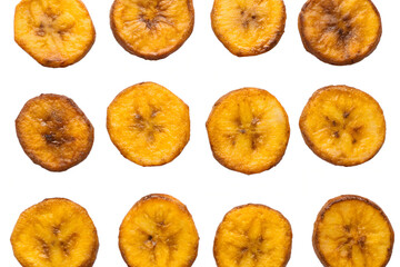 A collection of golden fried plantain slices arranged on a clean white background surface