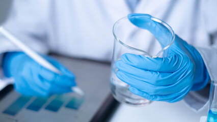 Chemist scientist working in laboratory science research test experiment data analysis report document biochemistry