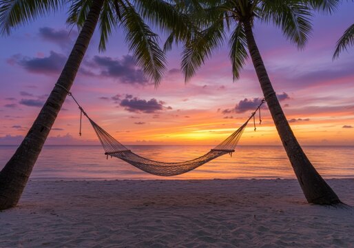 Tranquil beach hammock between palm trees at a vibrant tropical sunset - Powered by Adobe