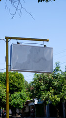 blank billboard on the street with blue sky background