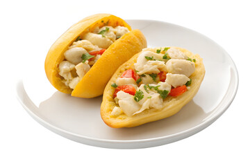 Two stuffed yellow plantains filled with white fish and red pepper on a white plate