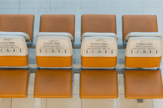 Empty waiting priority Seating in airport, Thai language. Priority seating at an airport - Powered by Adobe