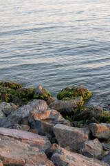 rocks in the water sunset orange rise