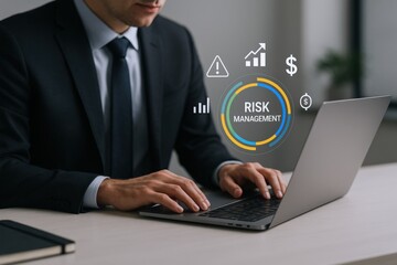 Businessman Analyzing Risk Management Data on Laptop with Digital Overlay in Office Environment
