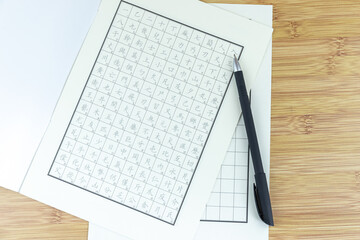 The pen and paper on the table