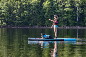 Woman and dog on a paddle board 1