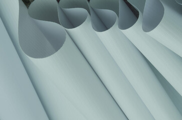 light green flexible fabric rolls. pastel color fabric samples with fibrous texture. banner material, digital printing industry