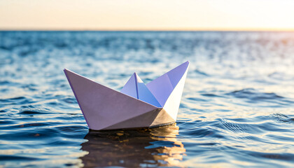 White paper boat on a quiet water surface with an endless horizon, with space for text