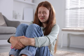 Teenage girl suffering from panic attack at home
