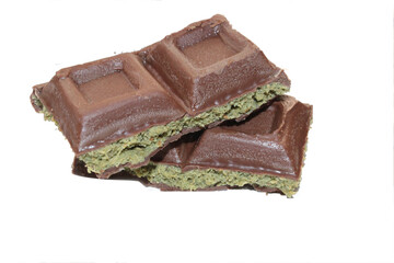Chocolate with pistachio isolated on white background. Close-up.