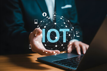 Man holds glowing IoT network globe connecting devices and data for futuristic business