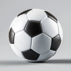 Classic black and white soccer ball, meticulously rendered, sits on a neutral gray background, casting a subtle shadow