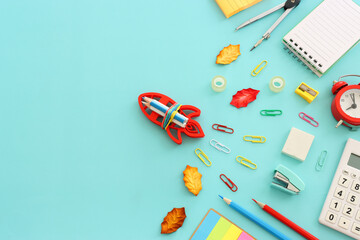 Back to school concept over blue background. Top view
