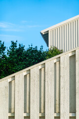 Modern Railing with Building and Greenery Background