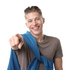 Handsome man laughing and pointing at something on white background. Positive emotion