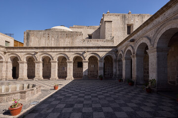 The Cloisters of the Company showcase elegant colonial architecture carved from white volcanic...