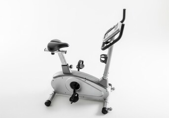 A sleek silver exercise bike with a black seat and digital display, perfect for home cardio workouts. Isolated white background. Fitness, Exercise, Gym, Equipment.