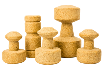 Set of five textured brown geometric weights with cylindrical bases isolated with transparent background