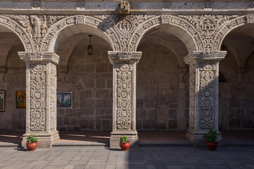 The Cloisters of the Company showcase elegant colonial architecture carved from white volcanic...