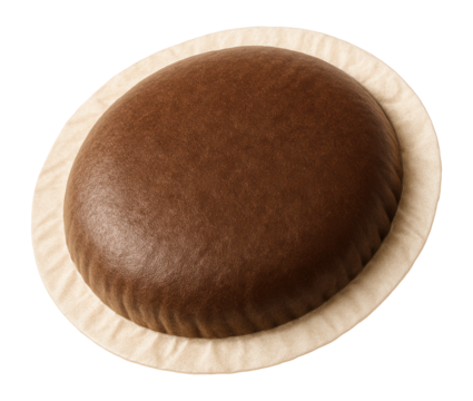 Round coffee pod wrapped in filter paper.